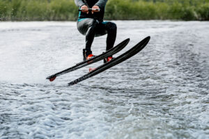 Read more about the article Man waterskiing on lake behind